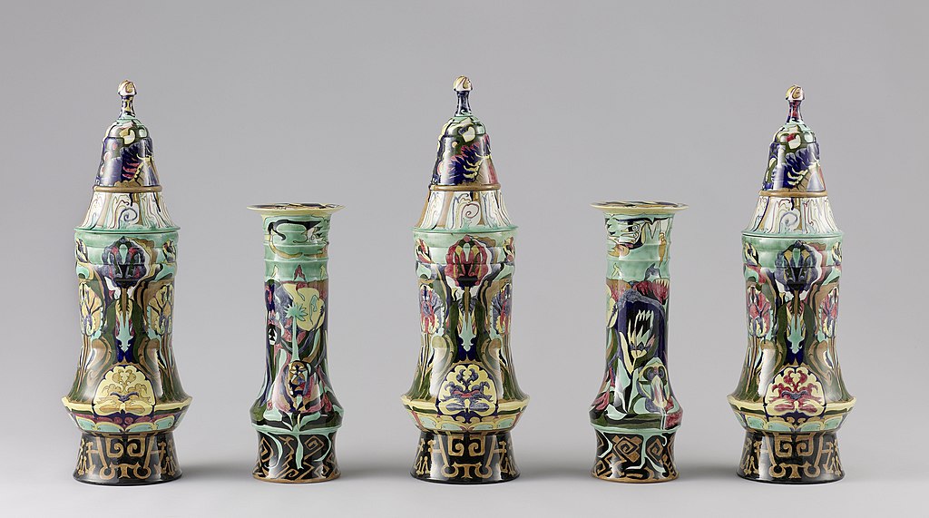 Rozenburg set of lidded and non lidded vases, designed by Theo Colenbrander for the Rozenburg pottery company in The Hague, The Netherlands.